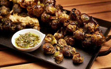 Grilled Brussels Sprouts Stalks with Curry Butter