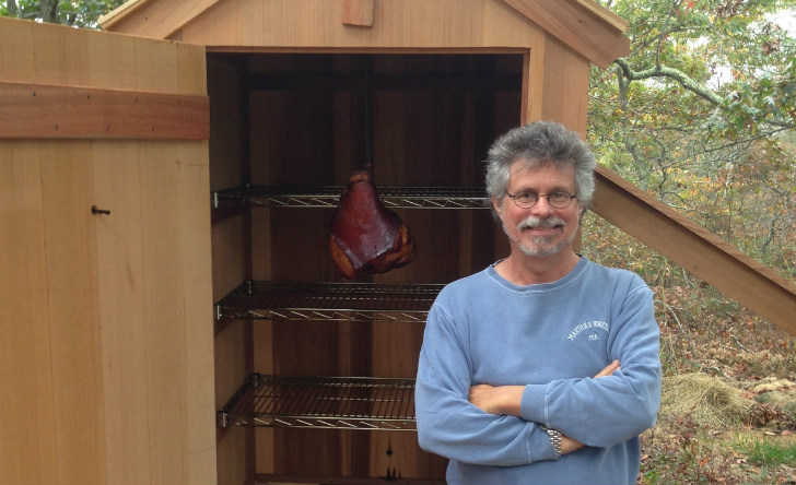 Steven Raichlen in front of smokehouse