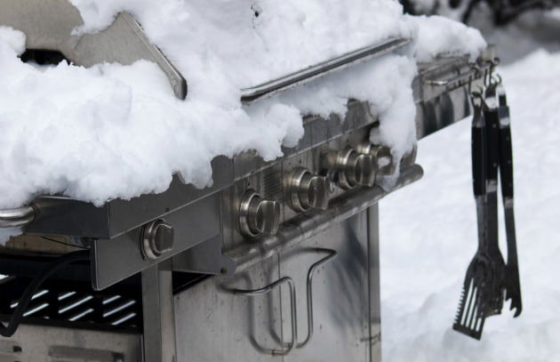 Grill covered in snow